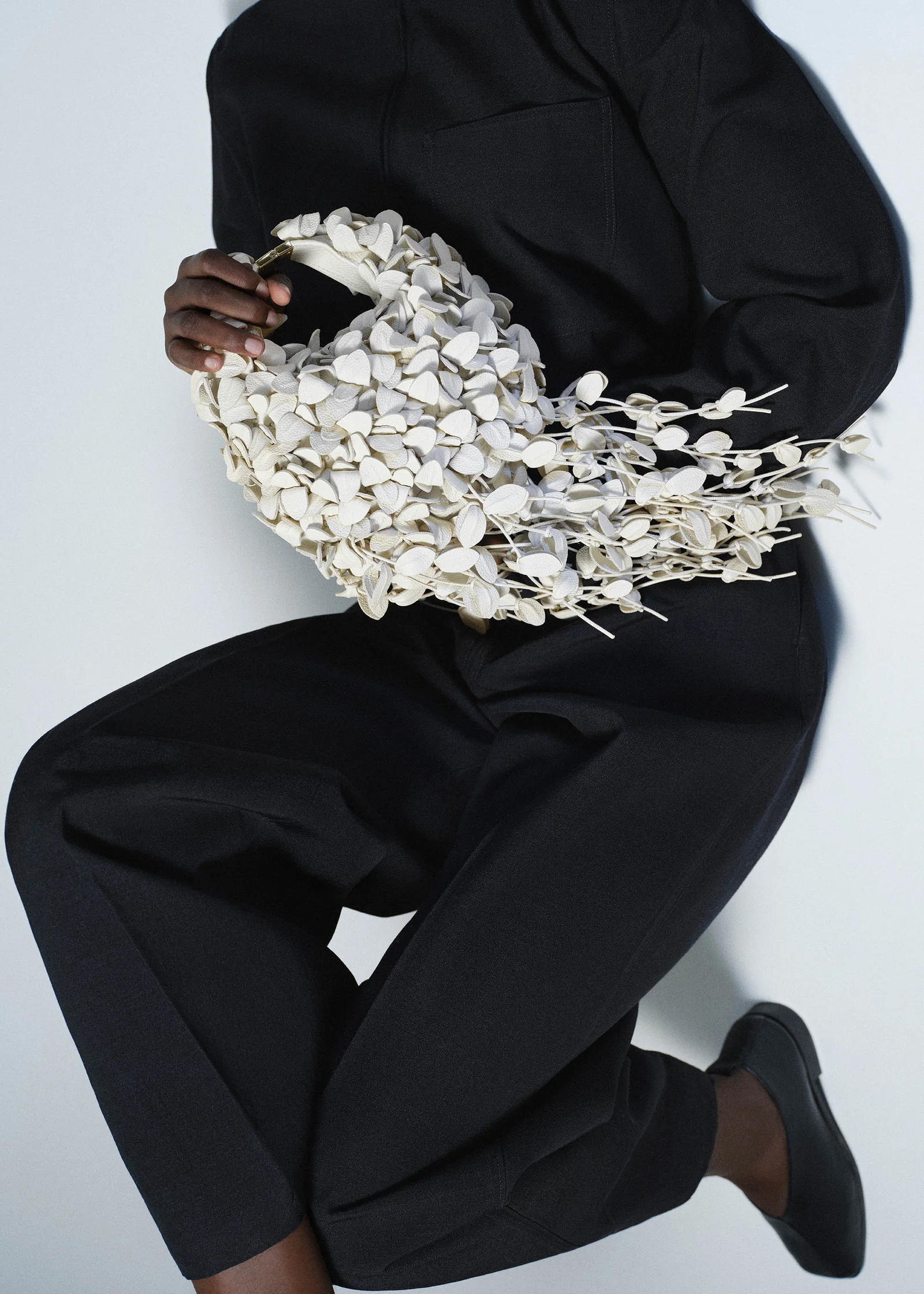The Polene Beri Lif in Porcelain, worn on the shoulder