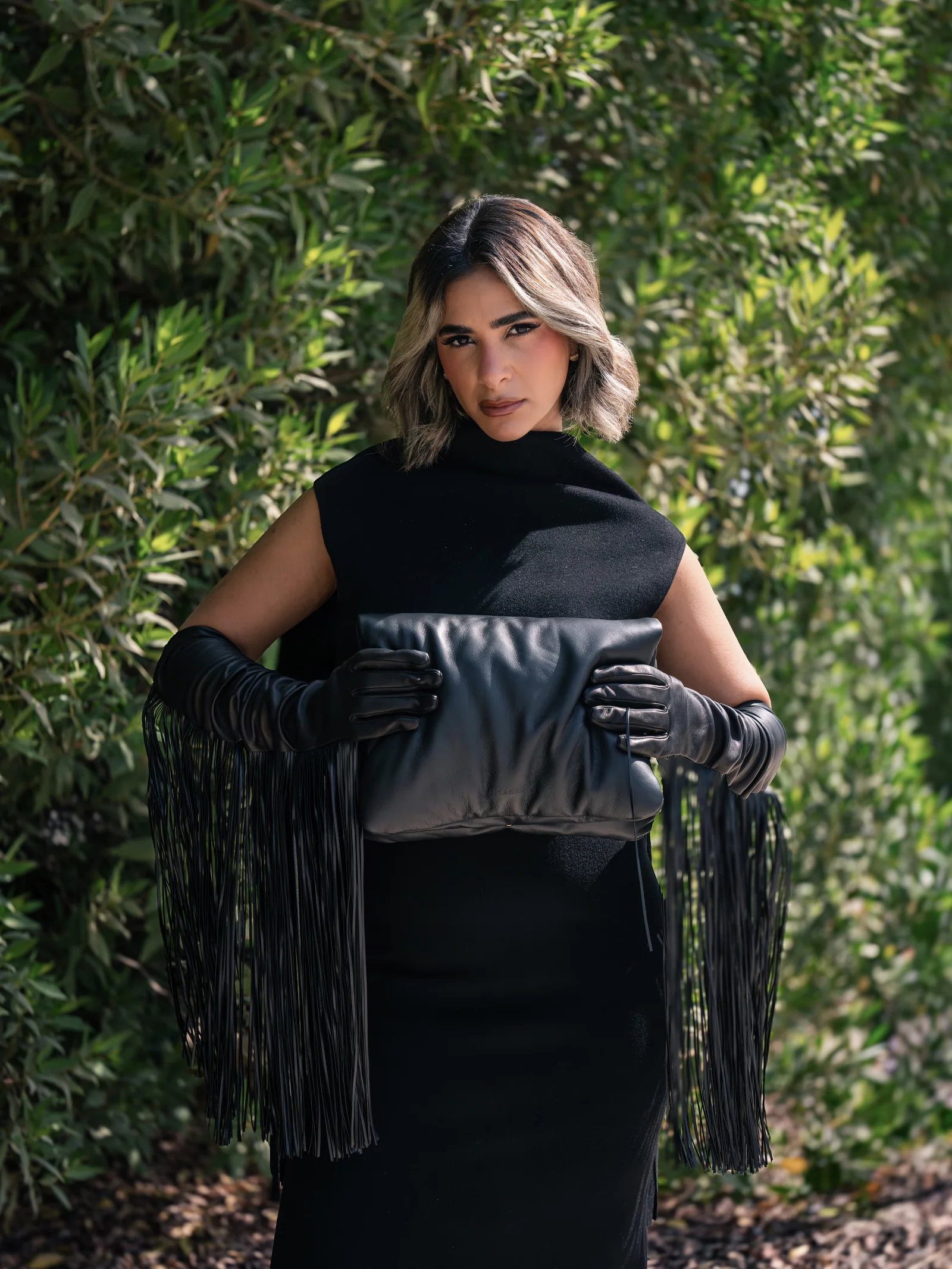 Daylal Al Hajeri seated in a tailored black look