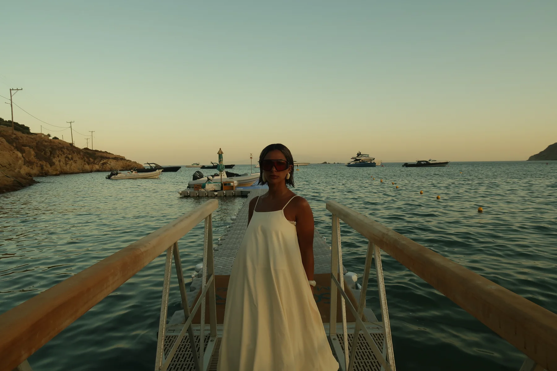 Daylal Al Hajeri in a flowing gown by the sea