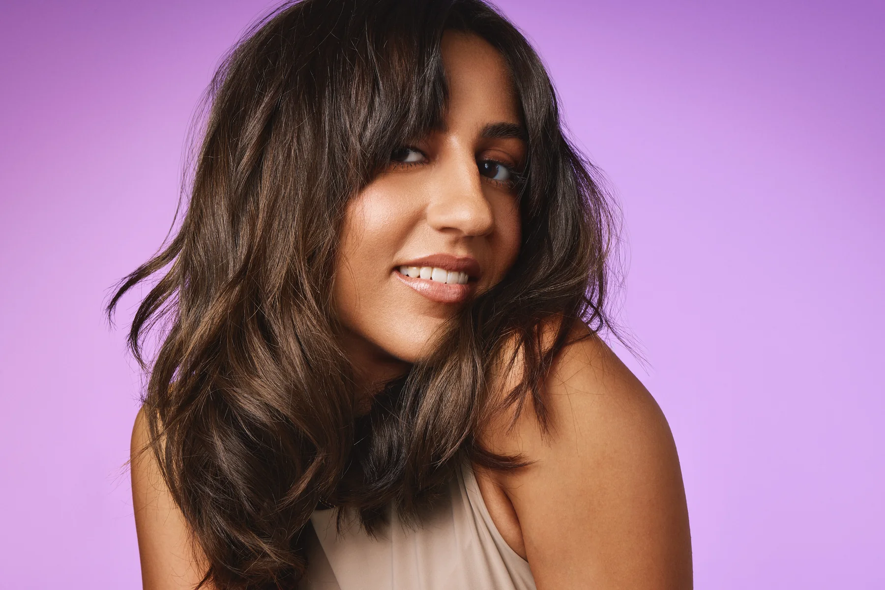 Model with wavy hair on a lilac backdrop, Sephora haircare campaign