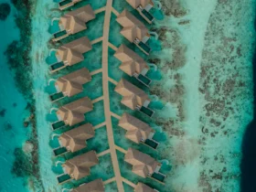 Aerial view of overwater villas at Sun Siyam Vilu Reef, Maldives