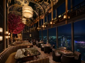 The suspended cherry blossom tree at TATTU Restaurant and Bar, Level 74, with the Dubai Marina skyline beyond