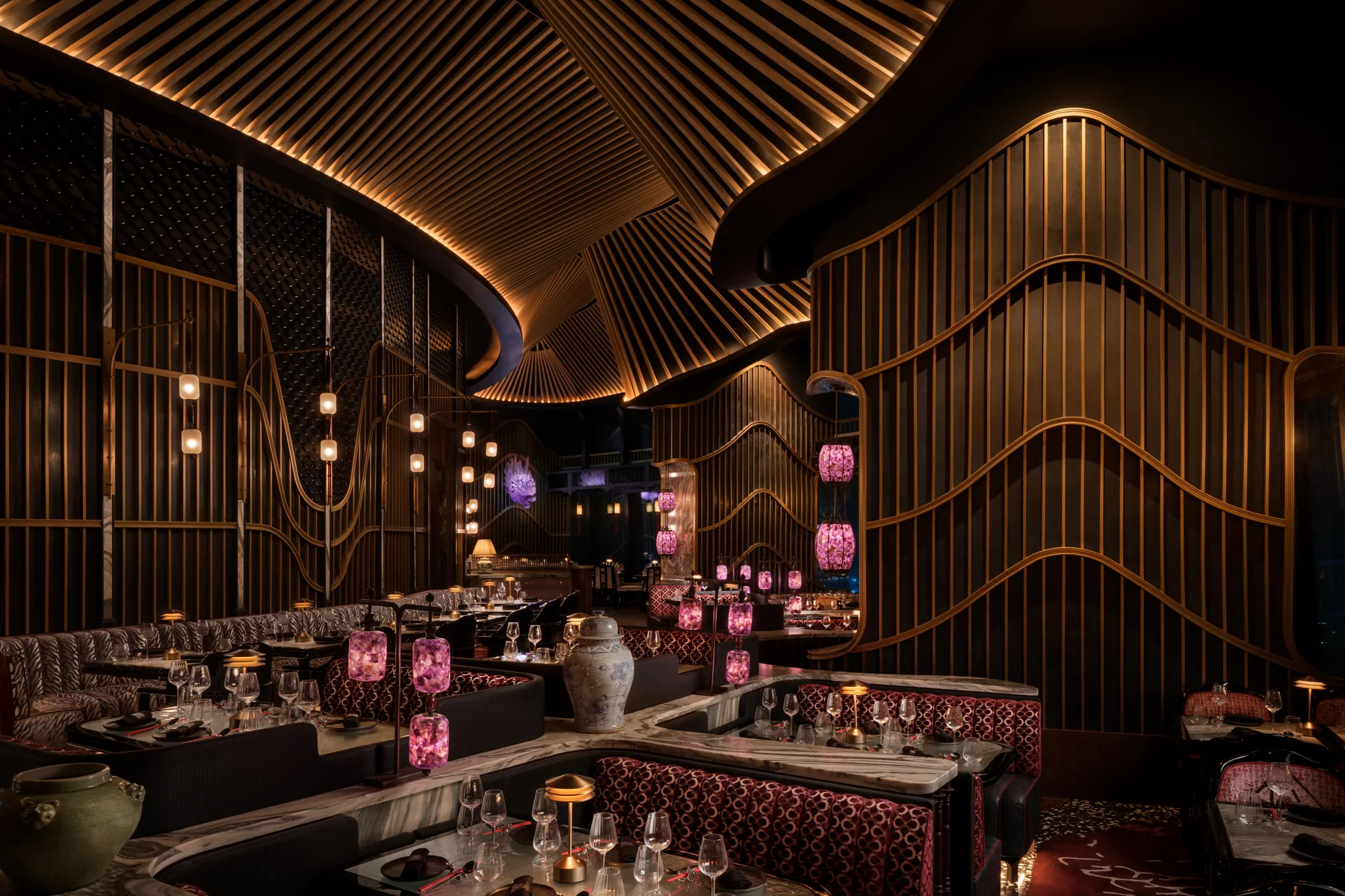 Interior detail at TATTU Restaurant and Bar, Level 74, with its sculpted ceiling and onyx accents