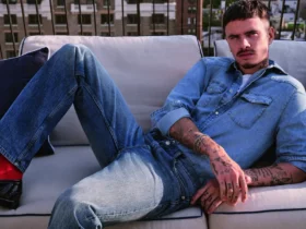 Romeo Beckham in a Tommy Hilfiger denim shirt and straight-leg jeans on a New York rooftop