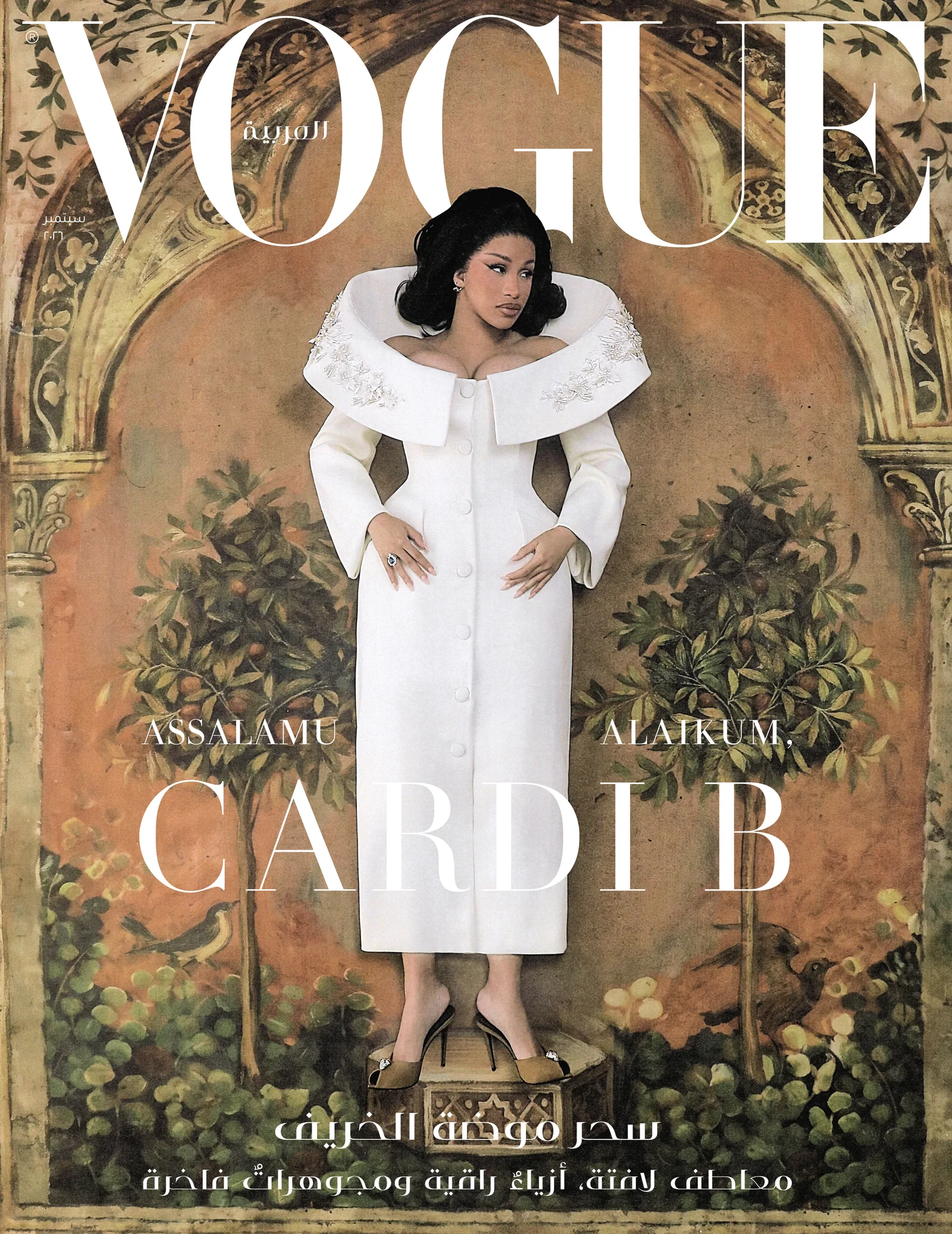 Cardi B in white against an Orientalist arch on a Vogue Arabia cover