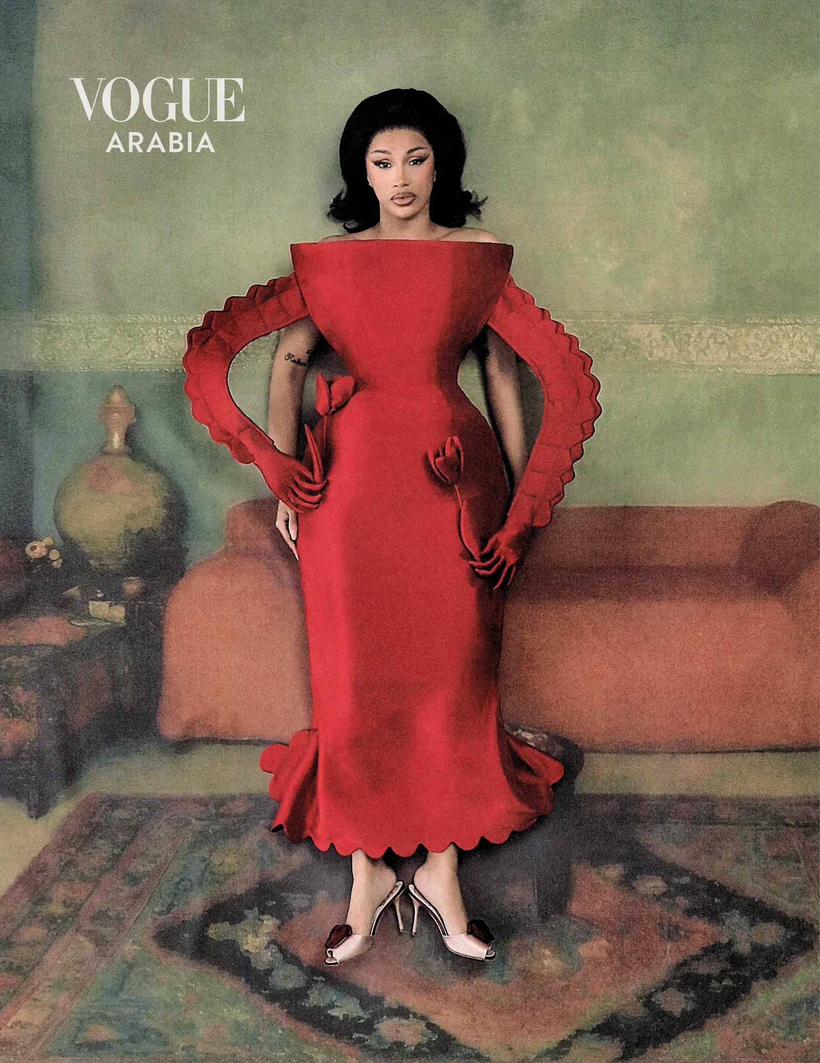 Cardi B in a scarlet off-shoulder gown with red gloves for Vogue Arabia