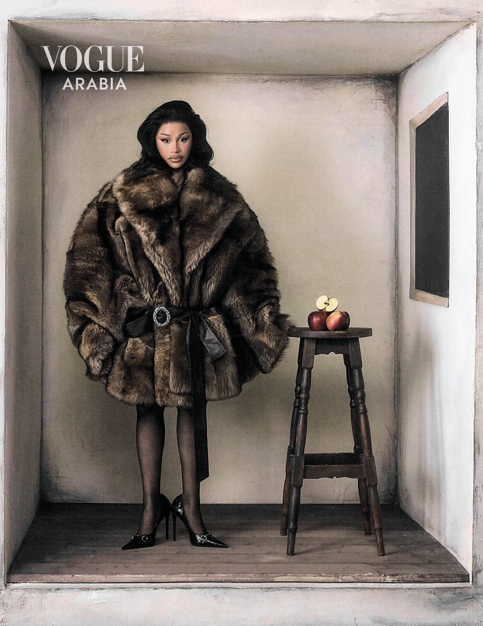 Cardi B in a brown fur coat on a bare set for Vogue Arabia September 2026