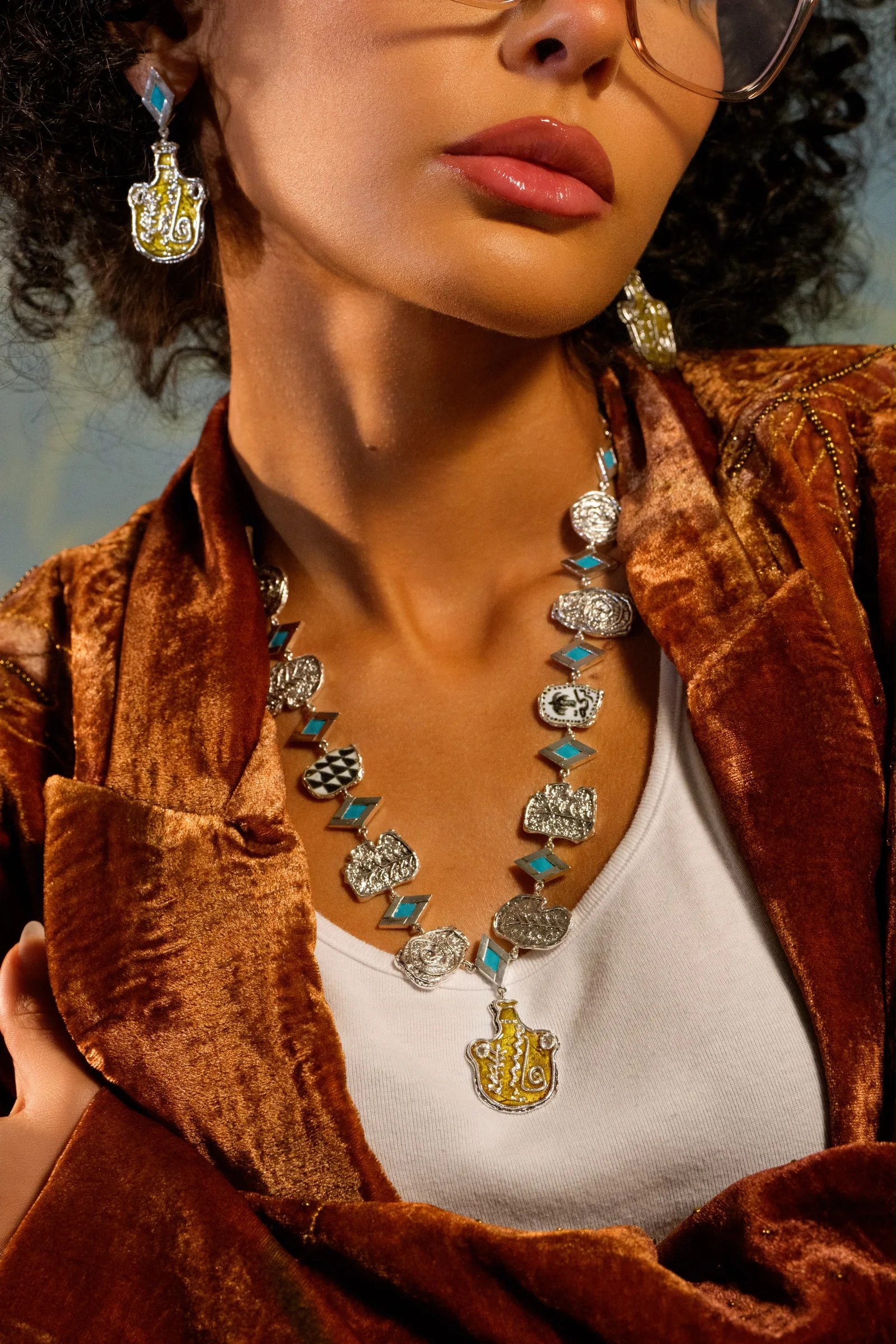 Farah Bastaki wearing a statement enamel necklace
