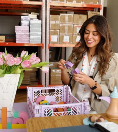 Lujain Abulfaraj with Akwan letter blocks at a work table