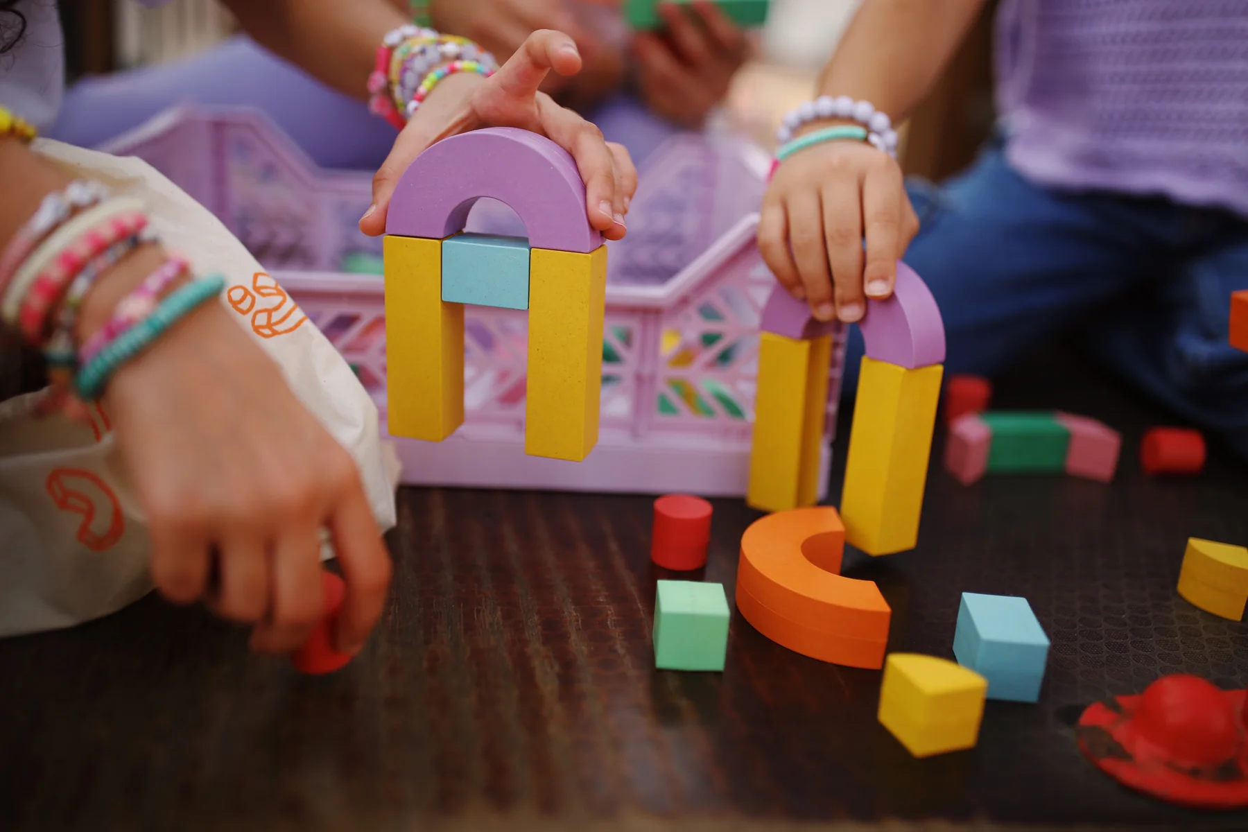 A small arch built from Akwan’s colourful letter blocks