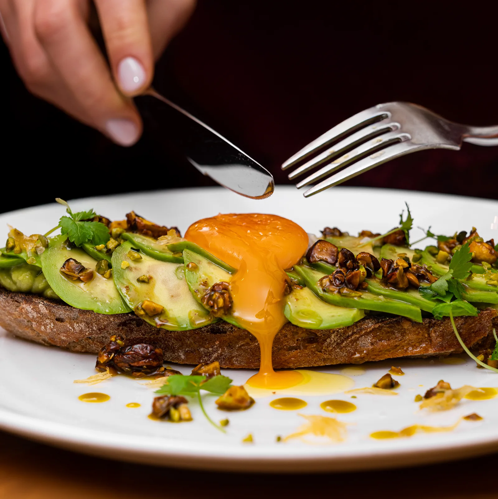 Pierre Herme avocado toast with confit egg yolk and pistachio vinaigrette