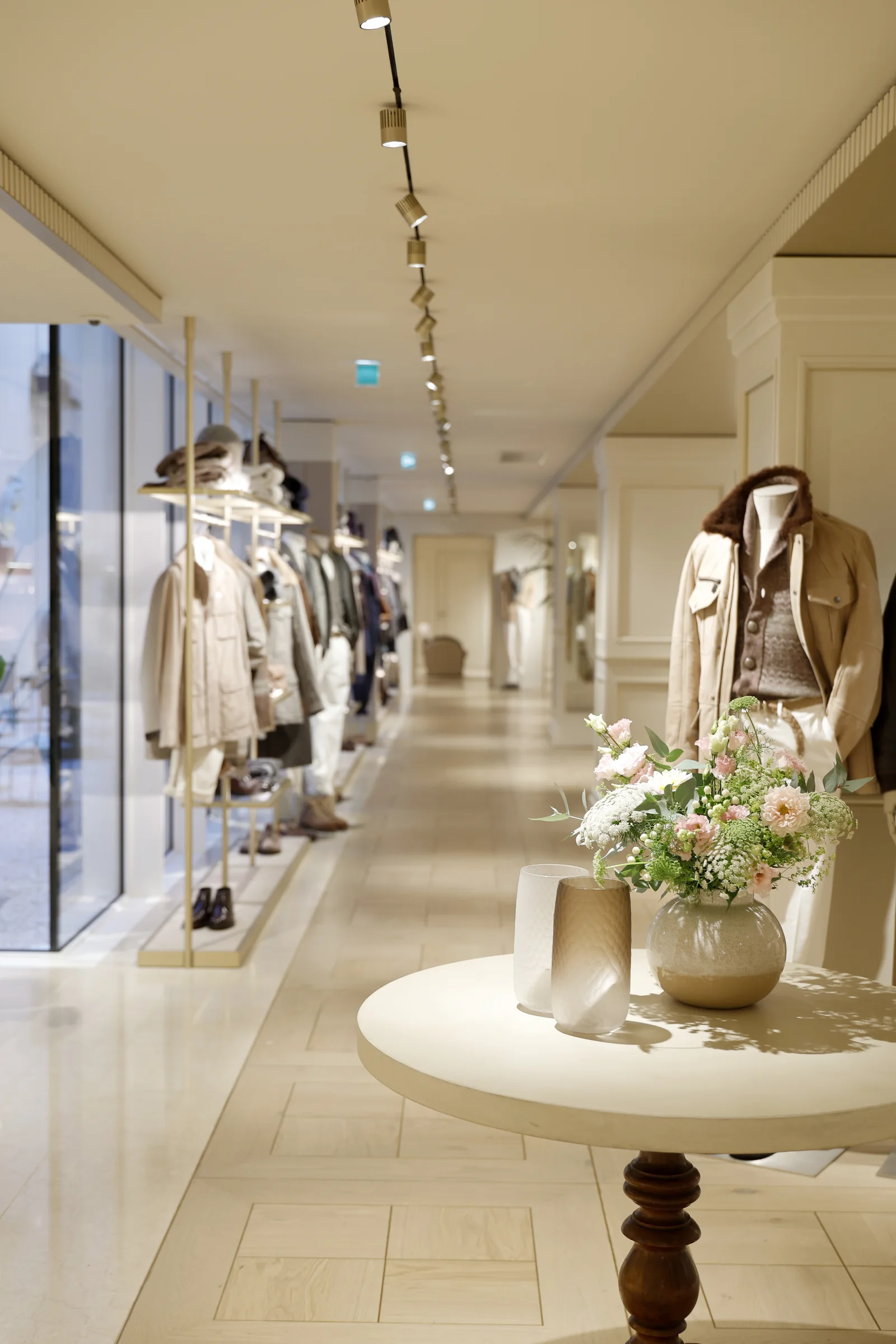 Brunello Cucinelli Saint-Honore, sunlit floor with a flower display