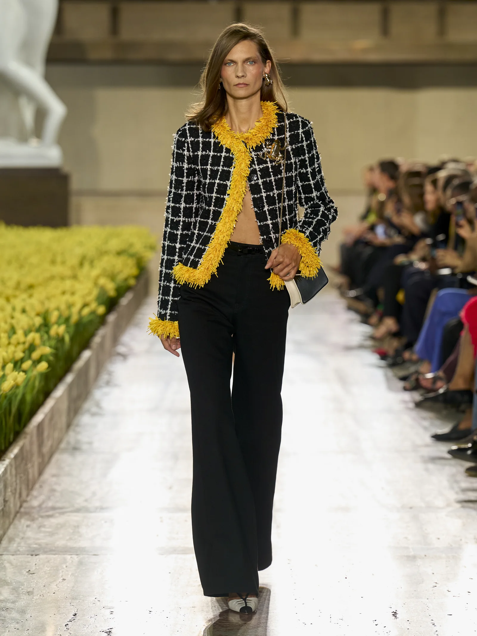 Carolina Herrera Spring 2027 windowpane tweed jacket trimmed in taxi-cab yellow with a wide-leg jean