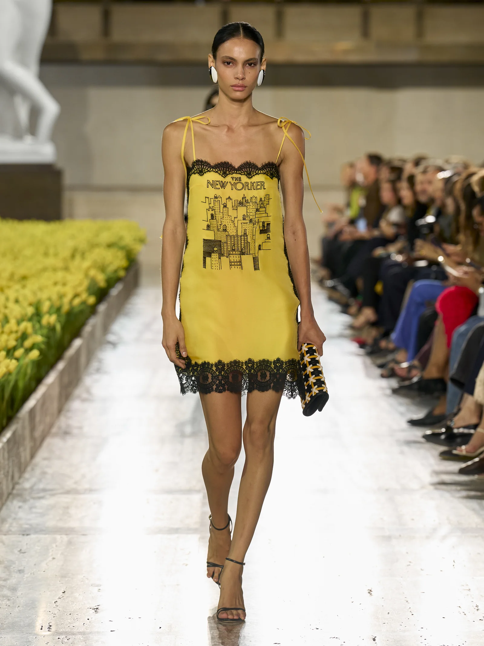 Carolina Herrera Spring 2027 taxi-cab yellow mini embroidered with a 1981 New Yorker cover
