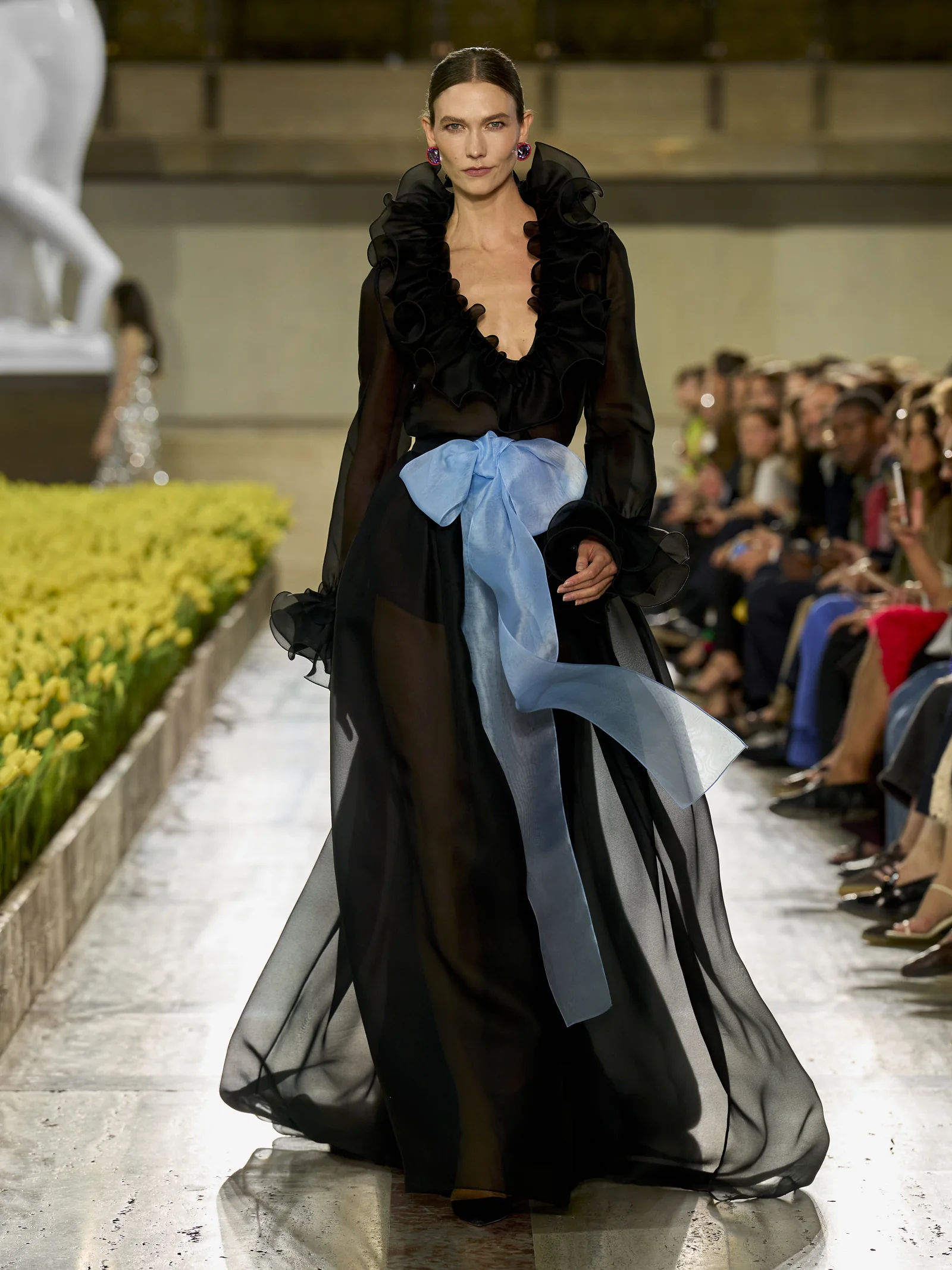 Karlie Kloss closing the Carolina Herrera Spring 2027 show in a black organza ball skirt