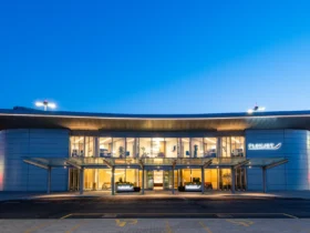 Flexjet's private terminal at Farnborough Airport lit at dusk