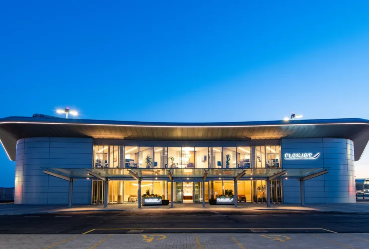 Flexjet's private terminal at Farnborough Airport lit at dusk
