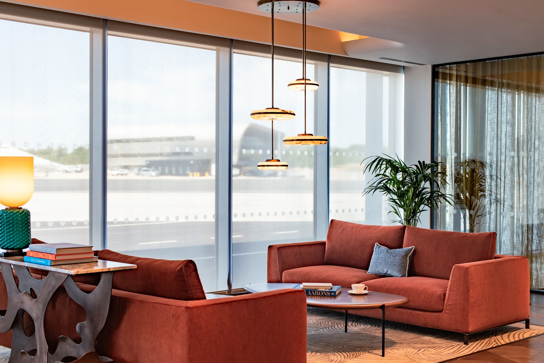A Flexjet terminal lounge with floor-to-ceiling views of the airfield