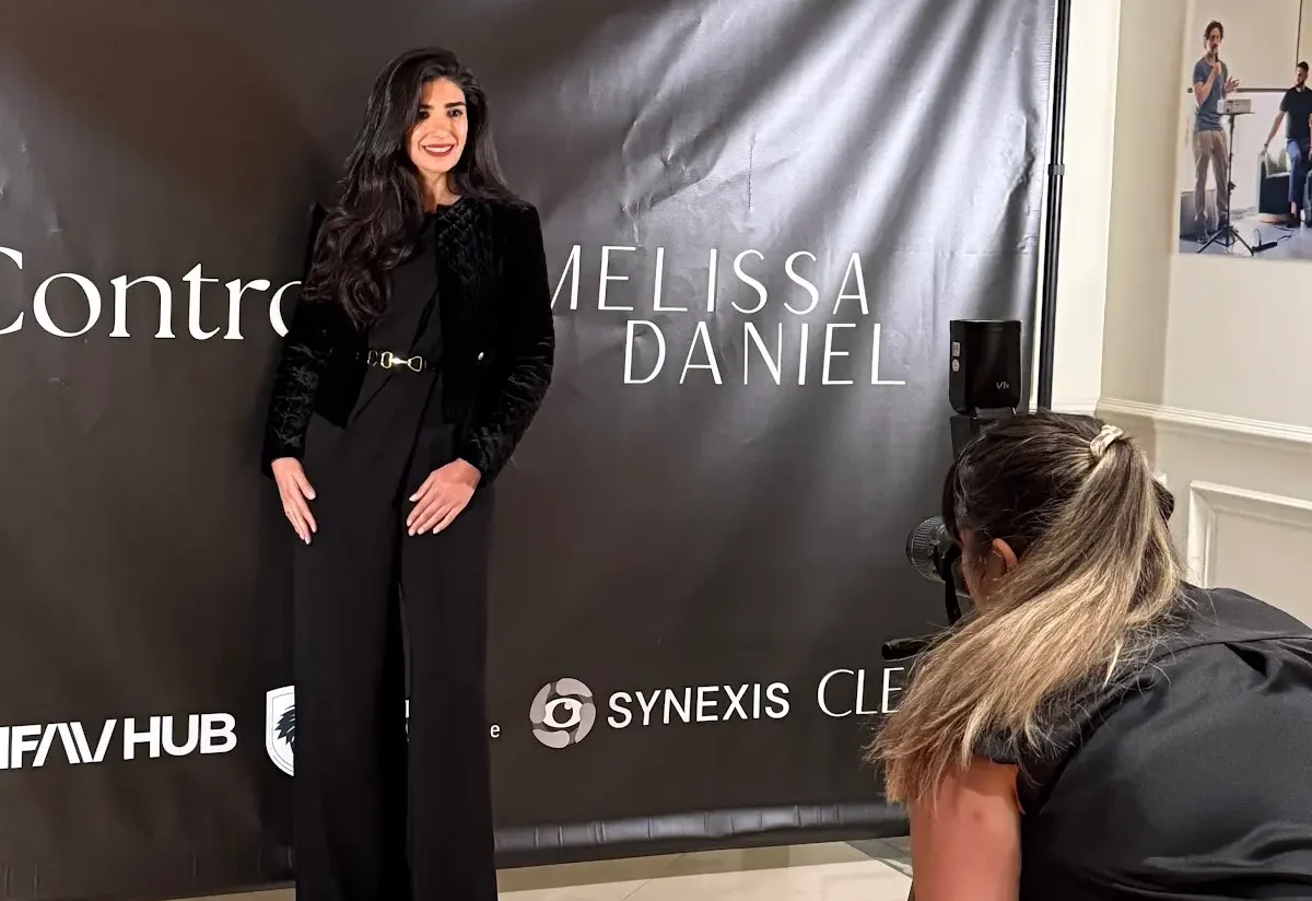 Dr. Noor AlQabandi at a press wall at an industry event