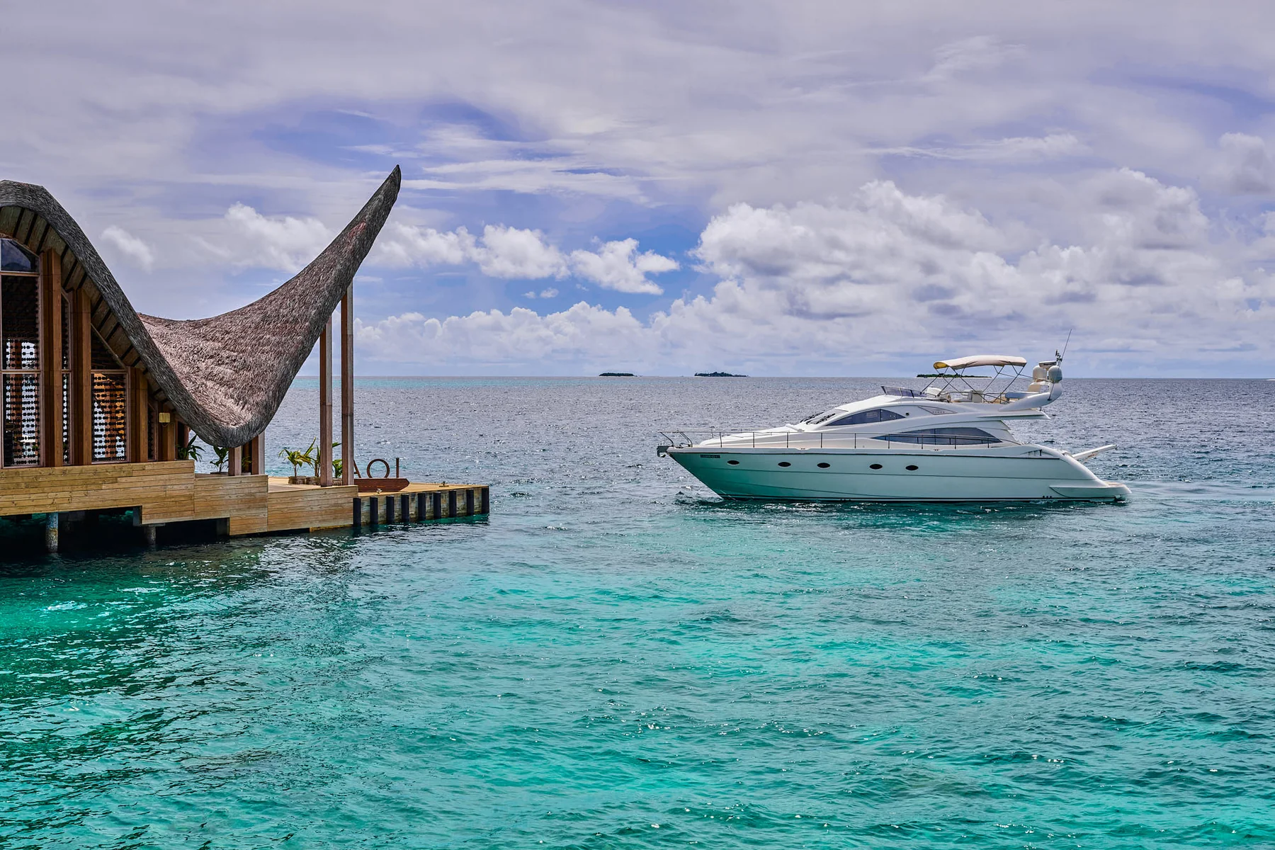 Private yacht on turquoise water at JOALI Maldives