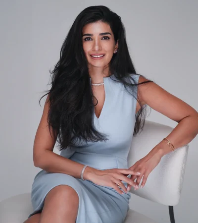 Dr. Noor AlQabandi photographed for Boujeez, seated portrait banner