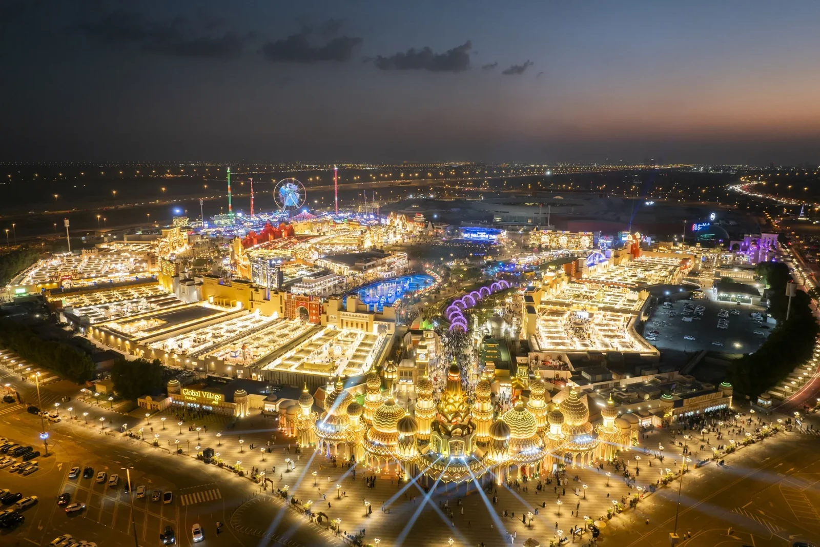 Global Village Dubai at night, aerial view of the lit pavilions