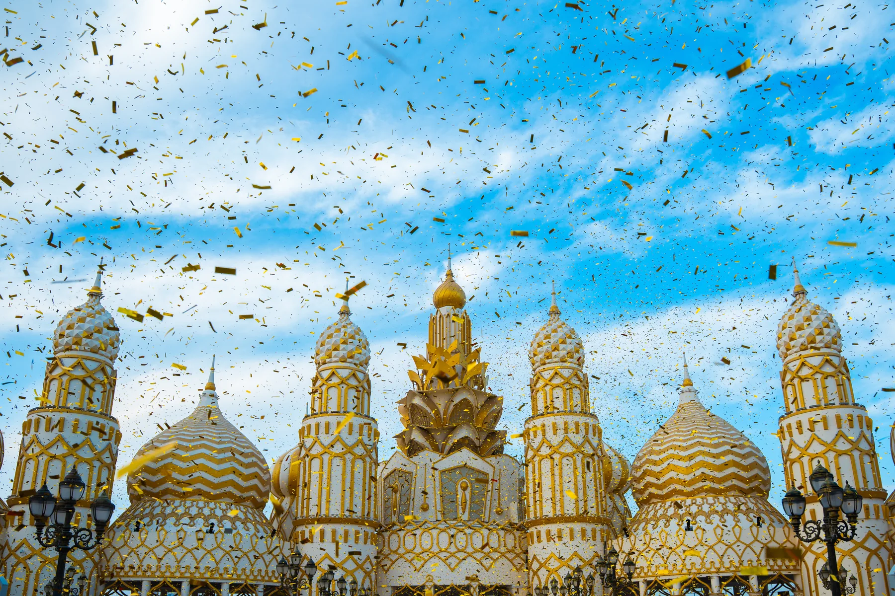 Global Village Dubai pavilions under a shower of golden confetti