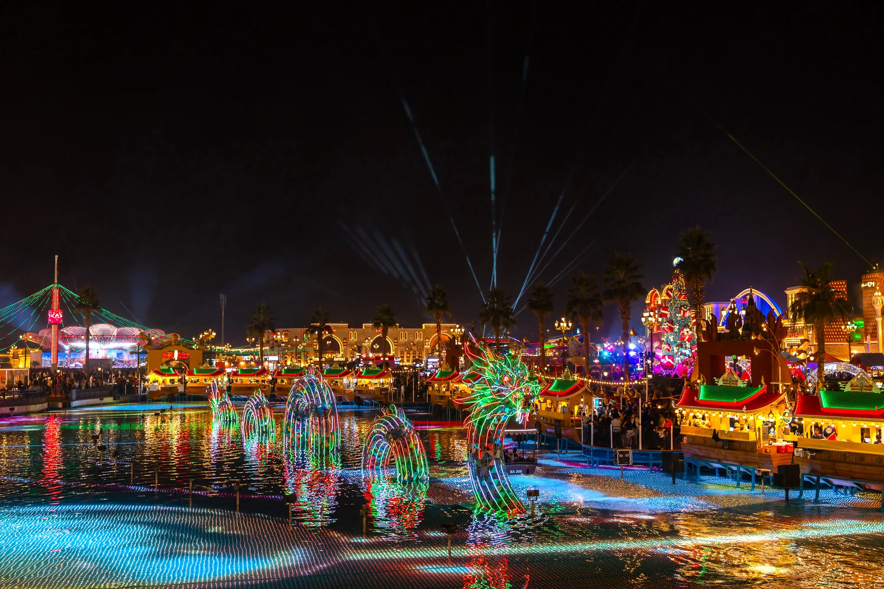 Global Village Dubai after dark, colourful lantern-lit pavilions